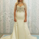 Beads that wrap the waist and frame the bust can minimize a bride's stomach and chest.