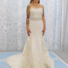 A thick beaded band at the waist of this fit and flare gown parallels to the straight line at the neck.