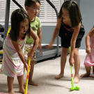 The kids play golf in the basement.