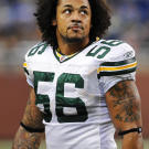 Nick Barnett, middle linebacker for the professional football team the Green Bay Packers, comes to High Voltage to see Kat. He's looking for a portrait of his late father placed on his inner bicep.