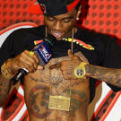 Hip-hop artist and producer Soulja Boy visits High Voltage to have Kat tattoo his last name on his right hand. His left already had his middle name, Kat was charged with matching the style, and was the first woman to tattoo the 19 year old rapper.