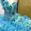 Dyed ostrich feathers adorn the bodice of Eden's wedding gown.