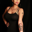 Tommy tattoos Ashley Elise with an inquisitive alien to capture her transformative life.