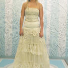 After Kelly's transformation, some volume was gone from the skirt, and a dropped waist with crystal belt emphasized the bride's figure. "I had no idea this dress had any potential at all," Courtney said of the