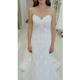 White can be the color of innocence, but this boned corset gown offers a hint of sex appeal, too.