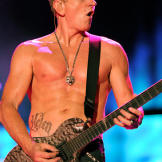 Lead guitarist in Def Leppard visits LA Ink with his fiance to get each other's name on their abdomens.