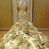 Kayla's 24-karat gold dress comes with a matching bolero jacket.