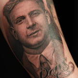 Tim tattoos a portrait of John's father to memorialize his burger joint named after his "Pops."