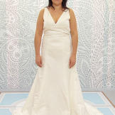 California bride Aisha requested a red, burlesque dress for her wedding. In her sister-in-law Amburr's