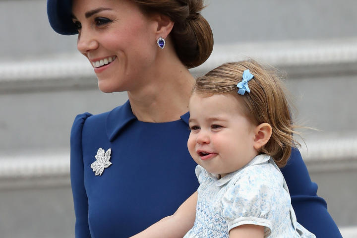 Duchess Catherine holding Princess Charlotte in Canada