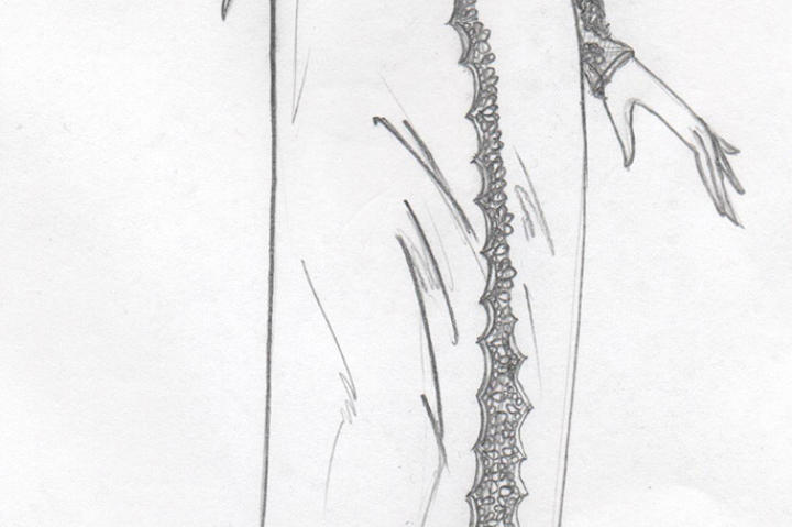 Kelly reimagined the hippie-chic gown with reapplied appliques along the collarbones as power shoulders, and along the open high slit in the leg.