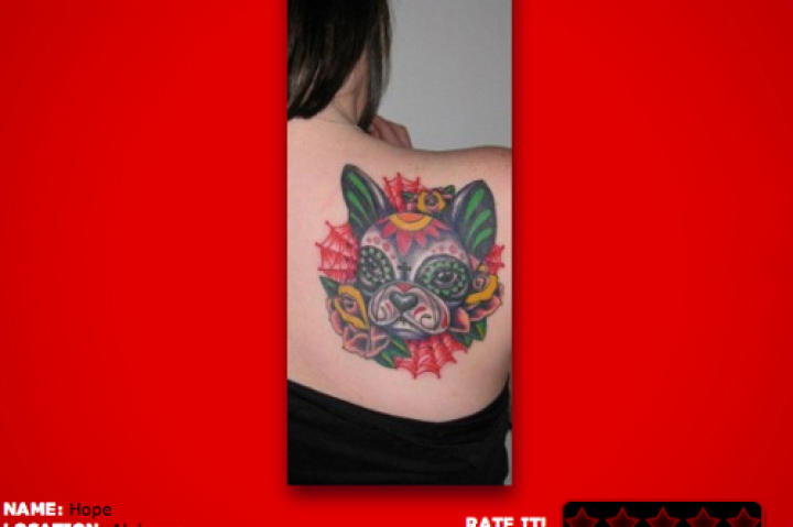 19. I am personally fond of sugar skull and Day of the Dead styled tattoos. I really like the creativity in making a sugar skull of her furry friend.