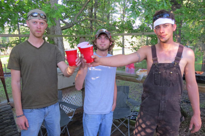 Chris "Flip" Woodall, Lathan Shivers and Dustin "Duck" Campbell cheers to their new home in the bayou.