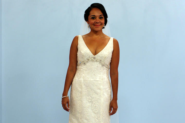 Karina, a 35-year-old California bride, hadn't had time to shop for a wedding dress -- she was too busy with her job and two children. When Sam found this deep V-neck, empire waist gown, she fell in love. It's a James Clifford design called Crystal Opulence, on sale for $1,250. Karina decided to wear her
