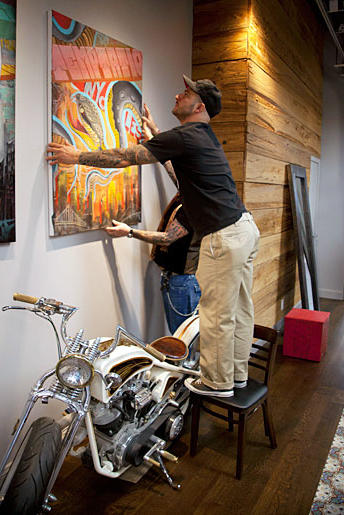 Billy DeCola hanging shop art.