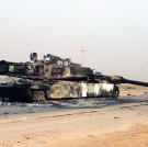 A scuttled M1A1 Abrams Main Battle Tank rests in front of a Fedayeen camp just outside of Jaman Al Juburi, Iraq during Operation Iraqi Freedom, 2003.
Watch video of the