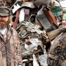 Willy (left) and Buck look for materials they can use to build a monster-trapping cage.
