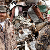 Willy (left) and Buck look for materials they can use to build a monster-trapping cage.