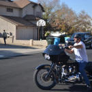 Ed Rosenberg arrives at a property auction on his motorcycle.