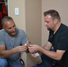 Ed Rosenberg and Steve Simons find a Rolex inside a newly acquired property.