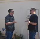 Scott Menaged and Steve Simons get into an argument before the auction starts.