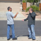 Buyers Doug Hopkins and Ed Rosenberg get into an argument while bidding on a house that's up for auction.