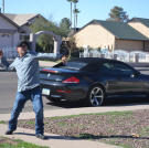 John Ray celebrates after successfully purchasing a property at auction.