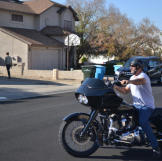 Ed Rosenberg arrives at a property auction on his motorcycle.