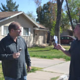 Scott Menaged and Doug Hopkins enjoy some ice cream before bidding on an auction property.