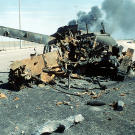 An Iraqi main battle tank on a highway south of Kuwait City destroyed in a Coalition attack during Operation Desert Storm, February 7, 1991.
Watch video of the