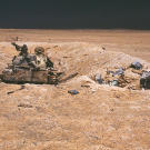 The charred remains of an Iraqi T-55 main battle tank lie abandoned after an attack by the 1st United Kingdom Armored Division during Operation Desert Storm, February 1991.
Watch
