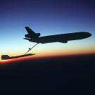 The unmistakable silhouette of an SR-71 Blackbird being refueled by a KC-10 Extender.