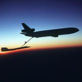 The unmistakable silhouette of an SR-71 Blackbird being refueled by a KC-10 Extender.