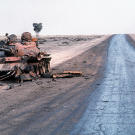 Destroyed Iraqi T-55A main battle tank lies abandoned beside a road at the edge of an oil field following Operation Desert Storm, March 1991.
Watch