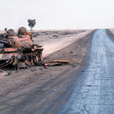Destroyed Iraqi T-55A main battle tank lies abandoned beside a road at the edge of an oil field following Operation Desert Storm, March 1991.
Watch