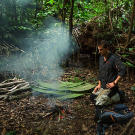 Getting a fire going in a damp jungle is often a challenge but Bear shows the best ways to find the right fuel and get a flame going. Here he's preparing a fire that can produce clouds of smoke to signal rescuers flying above.