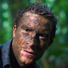 A simple way to defend exposed skin from swarms of mosquitos? Do what Bear dies and cover yourself in mud then let it dry into a crust that mosquitos struggle to bite through.