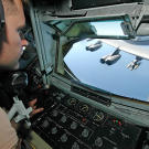 A boom operator of a KC-135 Stratotanker during an aerial refueling of a B-52 Stratofortress in Afghanistan, March 2006.