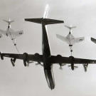 A U.S. Navy Convair R3Y-2 Tradewind set a record by simultaneously refueling four Grumman F9F-8 Cougar fighters in September 1956.