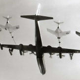A U.S. Navy Convair R3Y-2 Tradewind set a record by simultaneously refueling four Grumman F9F-8 Cougar fighters in September 1956.