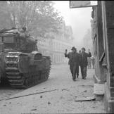 Surrendering German civilians pass a Churchill tank in Uelzen, Lower Saxony, Germany April 18, 1945.