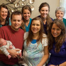 The birthing team with Baby Marcus, Josh, Anna and Michelle Duggar.
