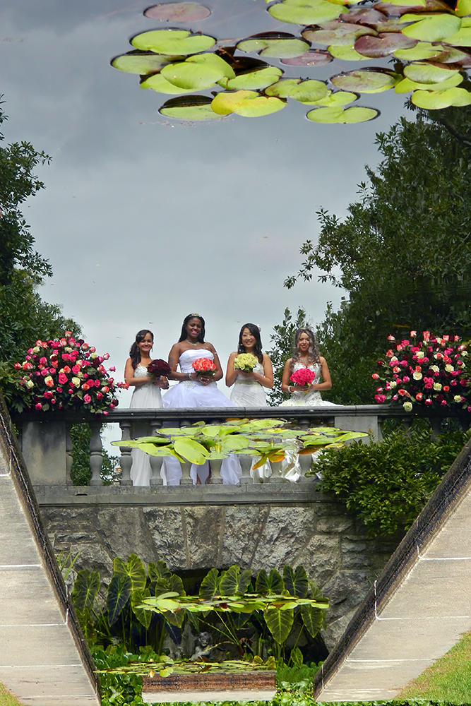 Brides Laura, Vanessa, Jenny and Stephanie's reflections in the fountain.