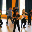 The kids try an 8-count just moments after their choreographer shows it to them.