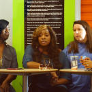 The moms watch as their kids rehearse.