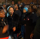The kids' parents have plenty to talk about while waiting outside at the cypher.