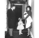 President Kennedy, Jackie, a young Caroline and baby John stand in the doorway of the White House on Feb. 4, 1961.
