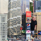 Bill's like King Kong in the Lego version of New York City.