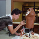 Justin works on his model torso for the six-pack implants he's designing.