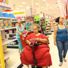 With encouragement from her doctor and personal trainer, Tara tries to walk around as much as possible. To navigate a large store, however, she needs to use a motorized scooter.